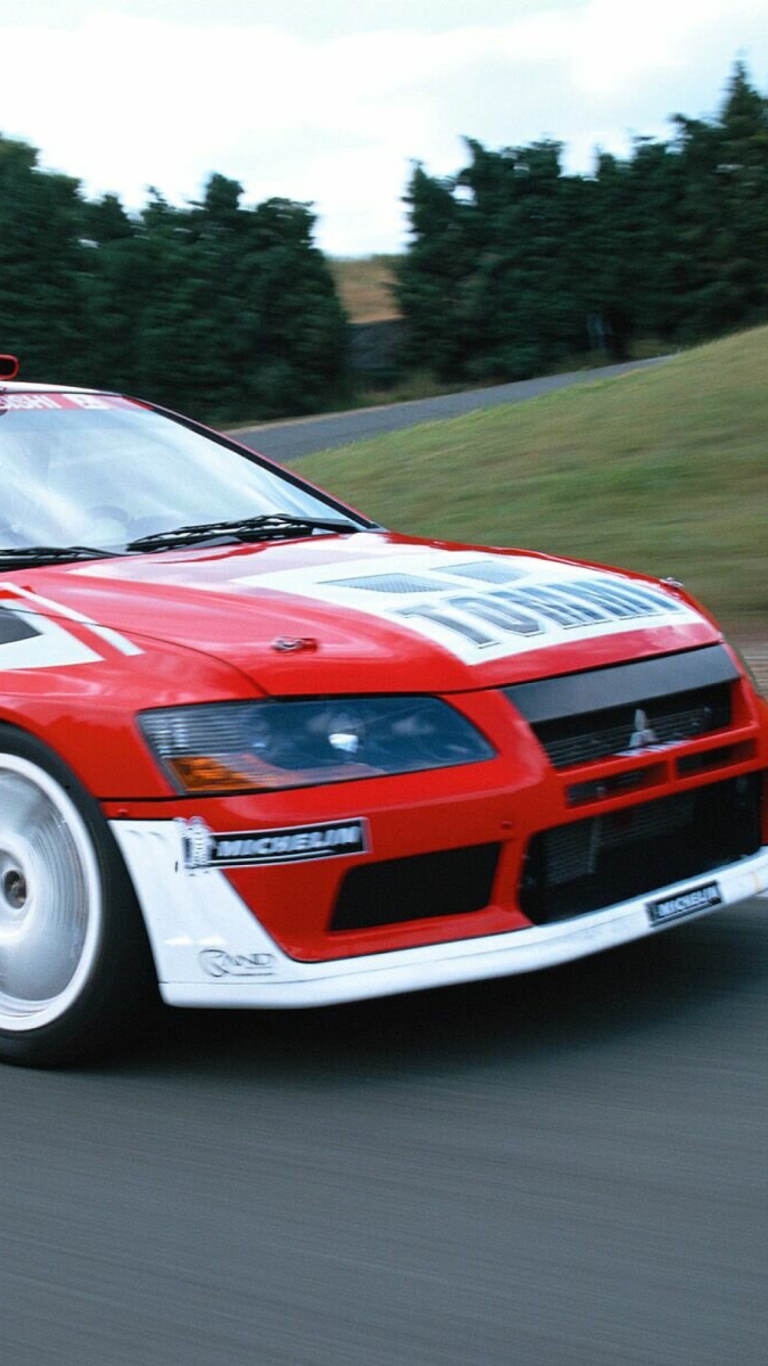 Обои Mitsubishi Lancer Evolution WRC 1080x1920