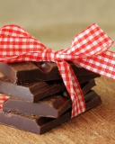 Das Chocolate And Red Bow Wallpaper 128x160
