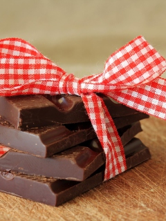 Chocolate And Red Bow wallpaper 240x320