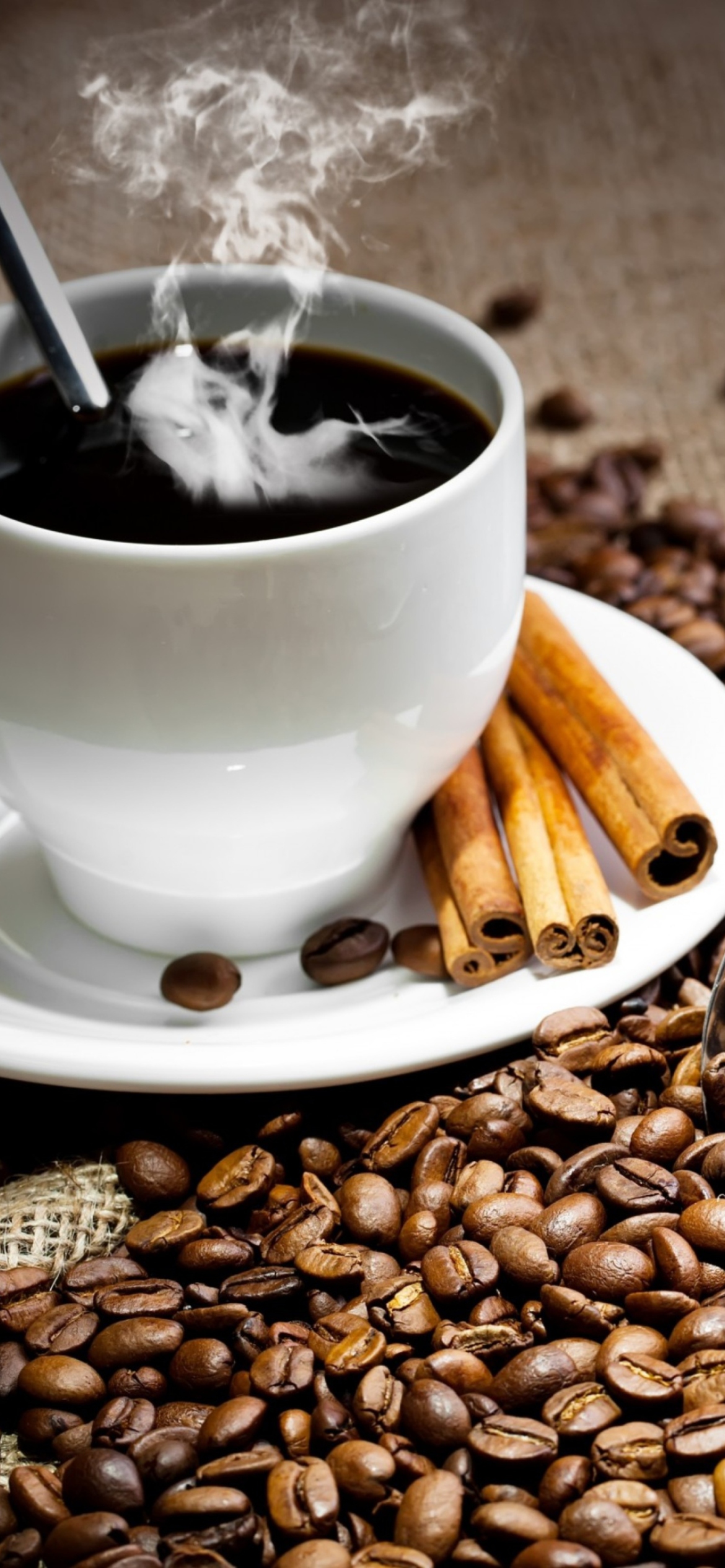 Cup Of Hot Coffee And Cinnamon Sticks wallpaper 1170x2532