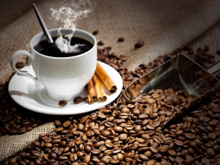 Обои Cup Of Hot Coffee And Cinnamon Sticks 320x240