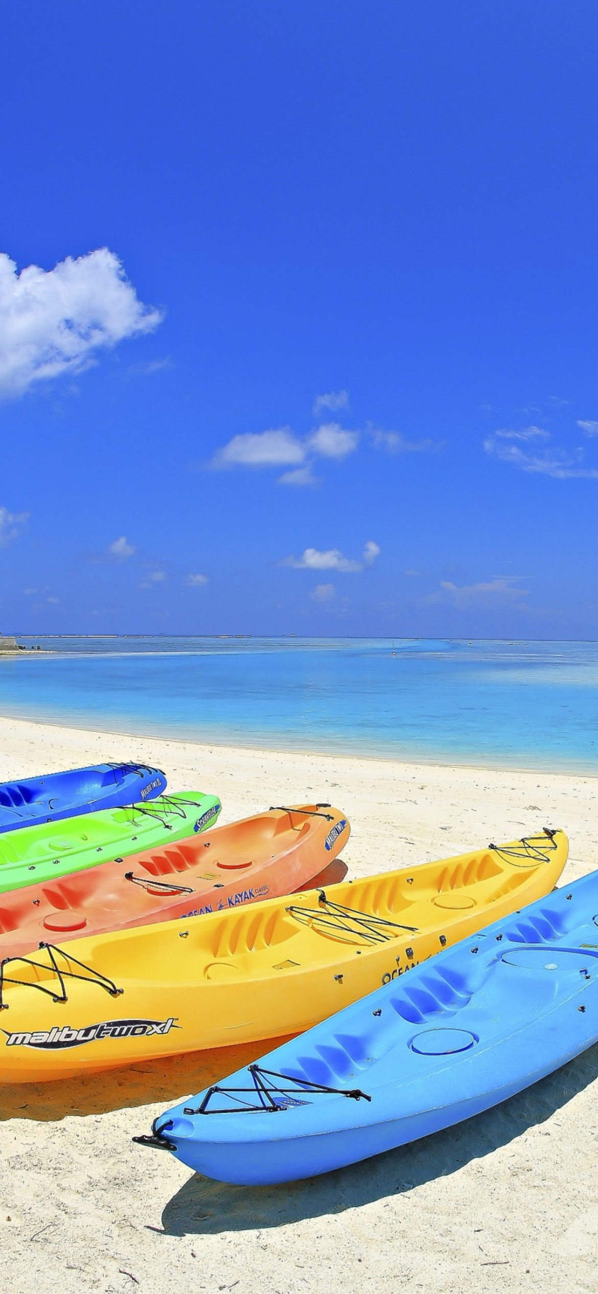 Fondo de pantalla Colorful Boats At Maldives Beach 1170x2532