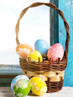 Easter eggs in basket wallpaper 240x320