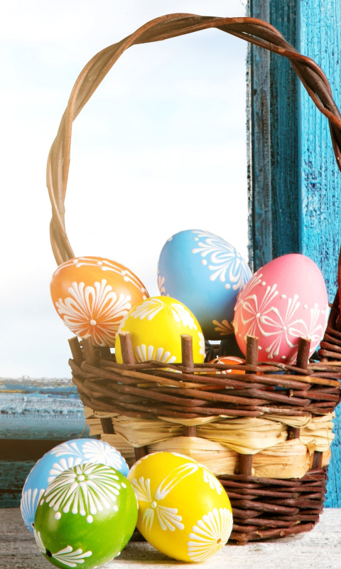 Das Easter eggs in basket Wallpaper 480x800