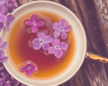Das Cup Of Tea And Lilac Flowers Wallpaper 220x176