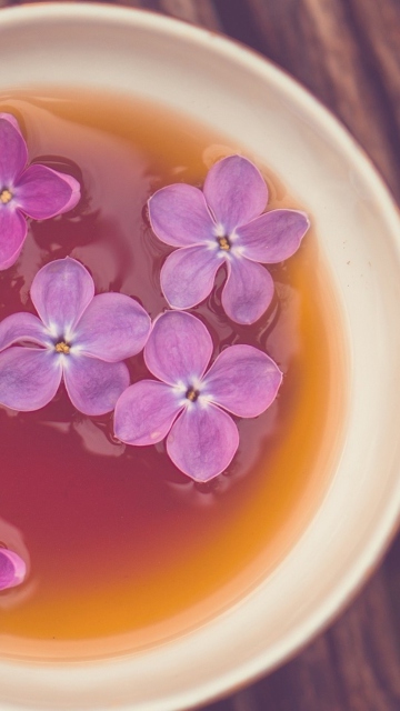 Cup Of Tea And Lilac Flowers wallpaper 360x640