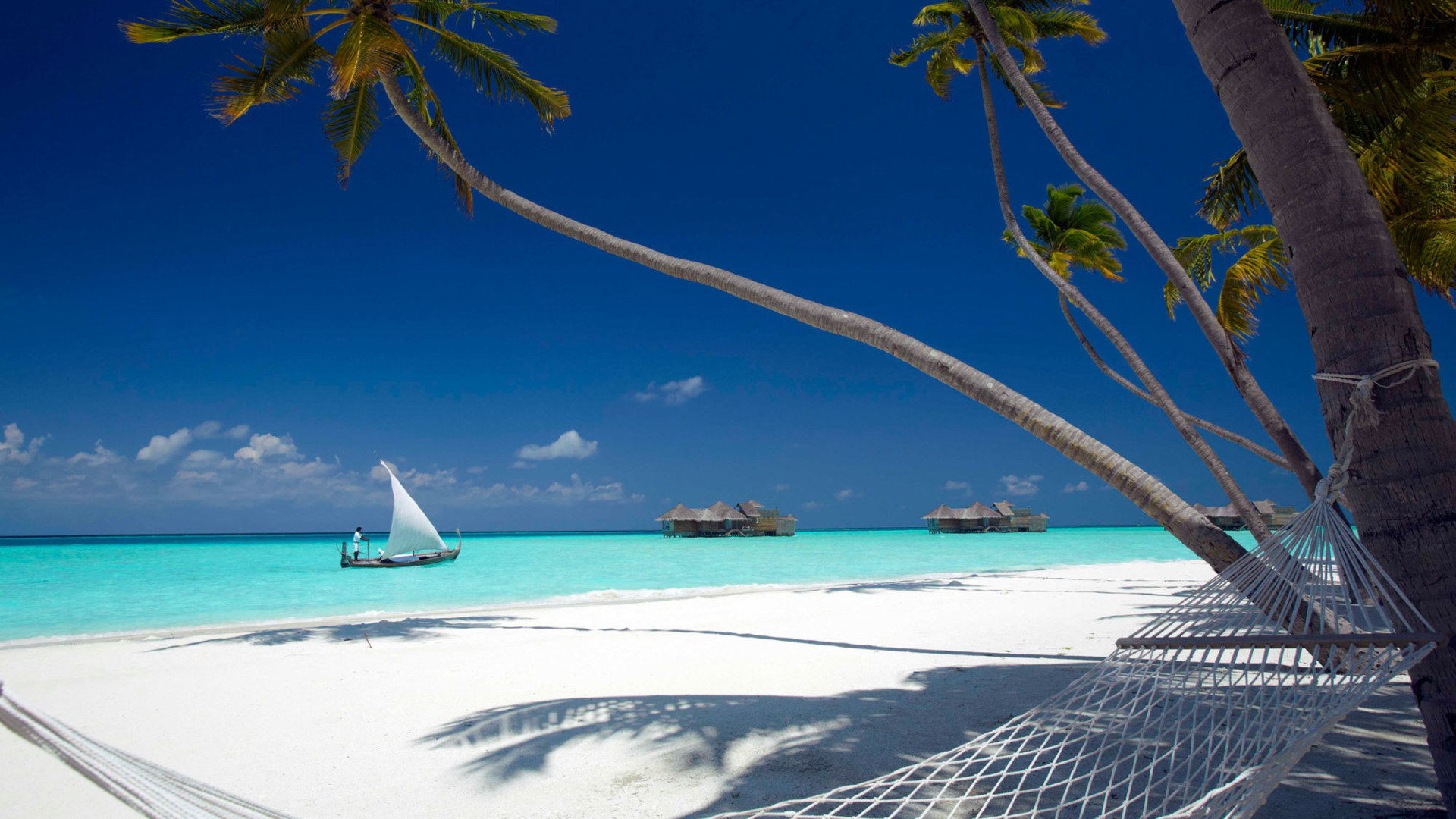 Beach With View Of Ocean And White Boat wallpaper 1920x1080