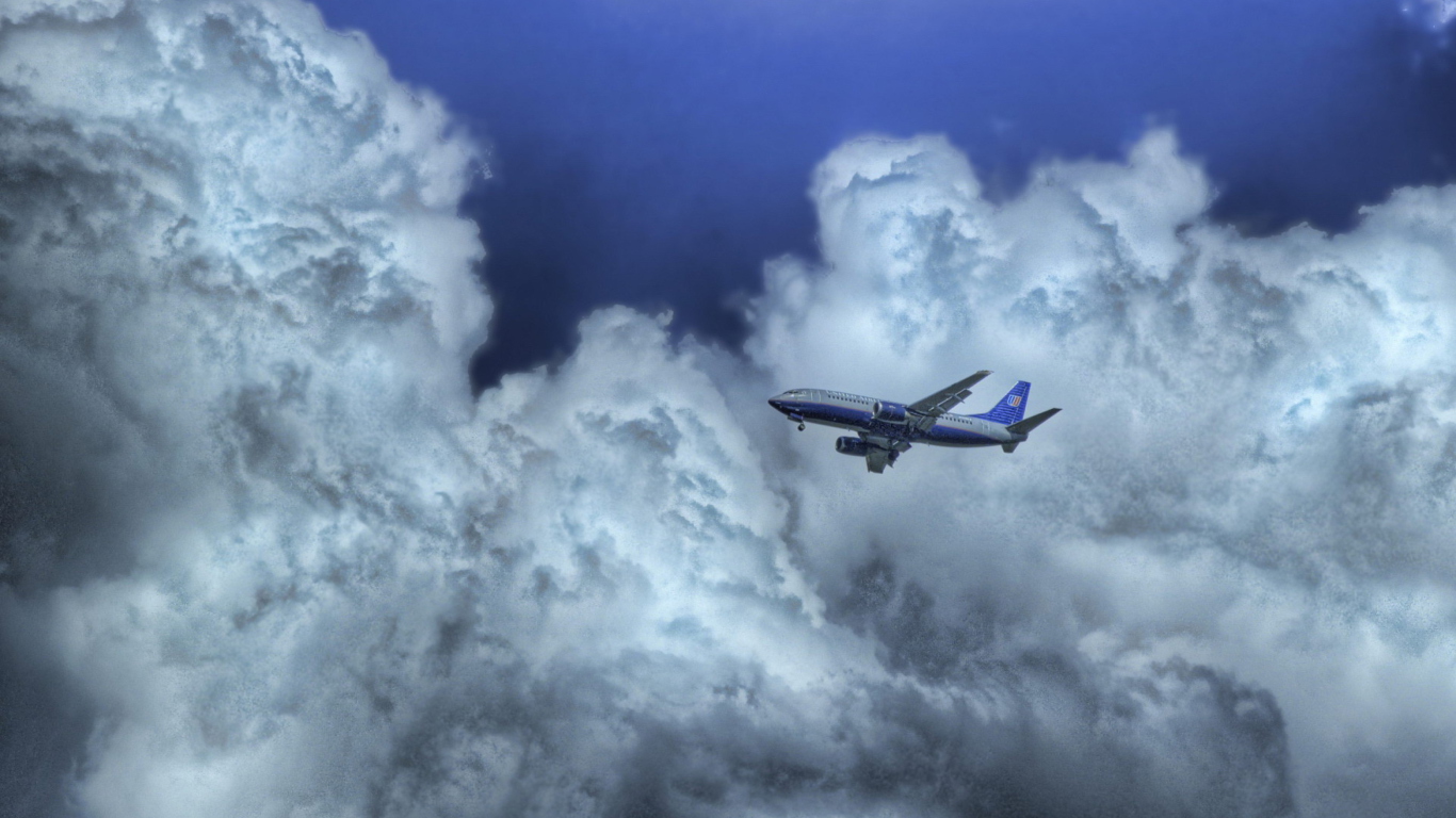 Airplane In Clouds wallpaper 1366x768