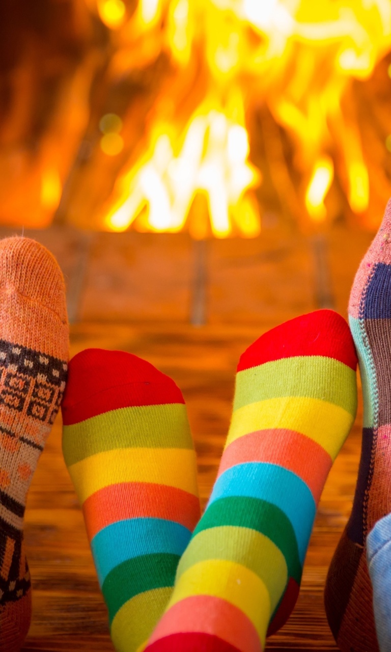 Happy family near fireplace screenshot #1 768x1280