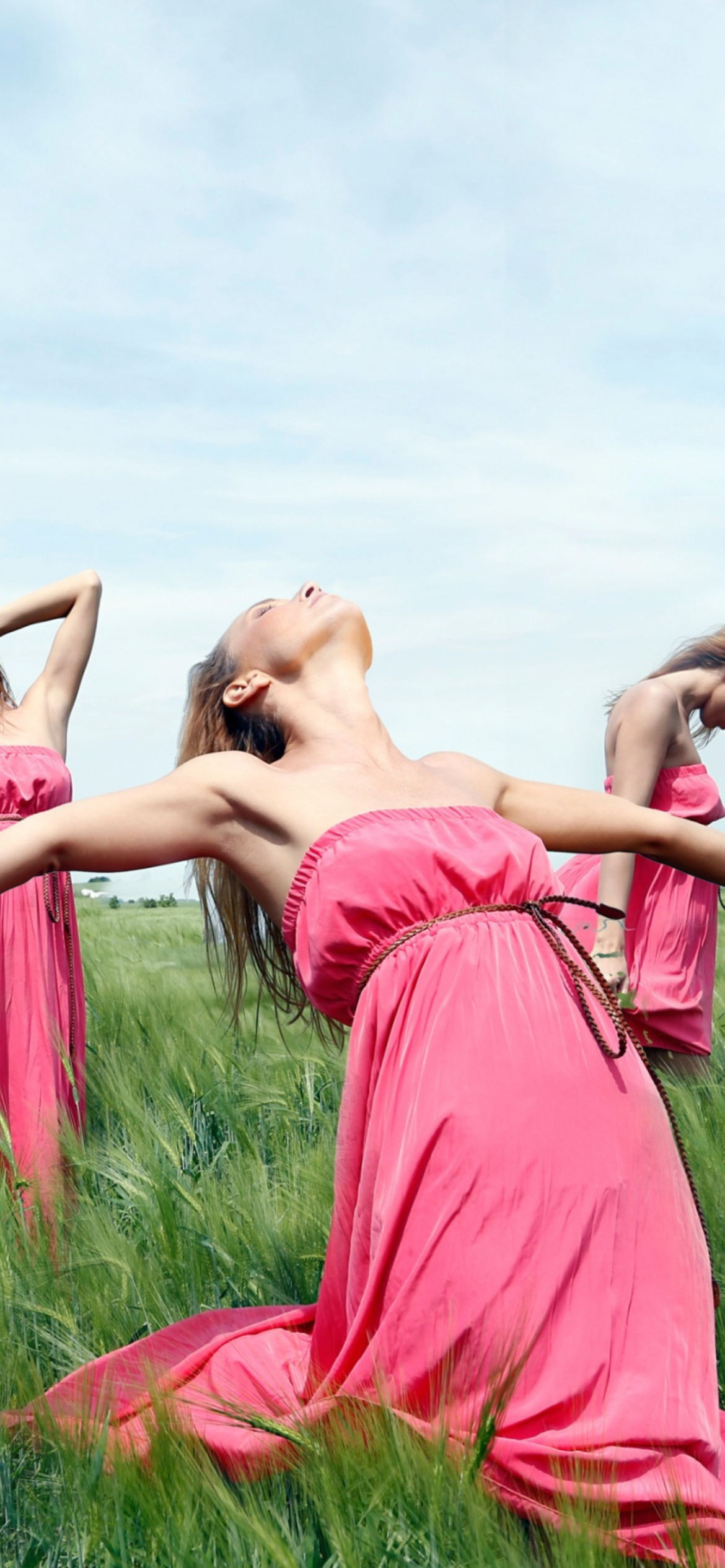 Girl In Pink Dress Dancing In Green Fields wallpaper 1170x2532