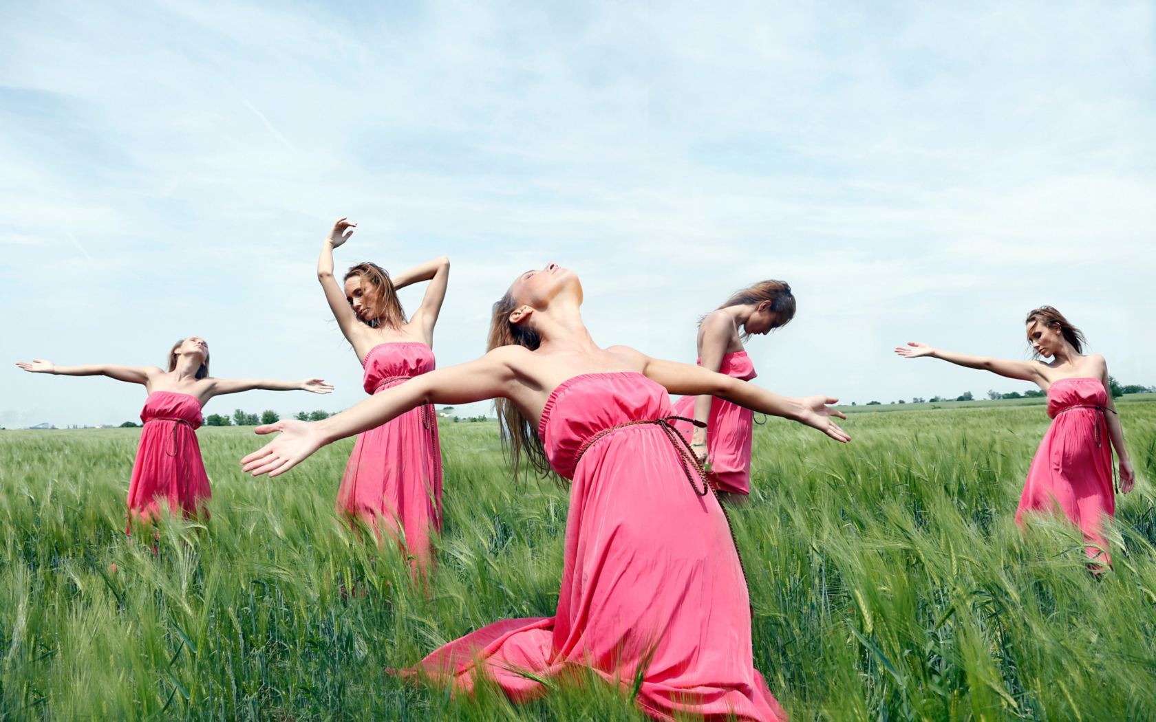 Girl In Pink Dress Dancing In Green Fields wallpaper 1680x1050