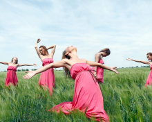 Girl In Pink Dress Dancing In Green Fields wallpaper 220x176
