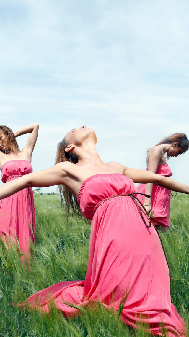 Girl In Pink Dress Dancing In Green Fields wallpaper 640x1136