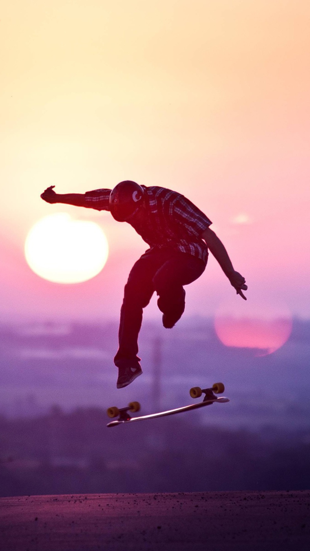 Fondo de pantalla Sunset Skateboard Jump 1080x1920