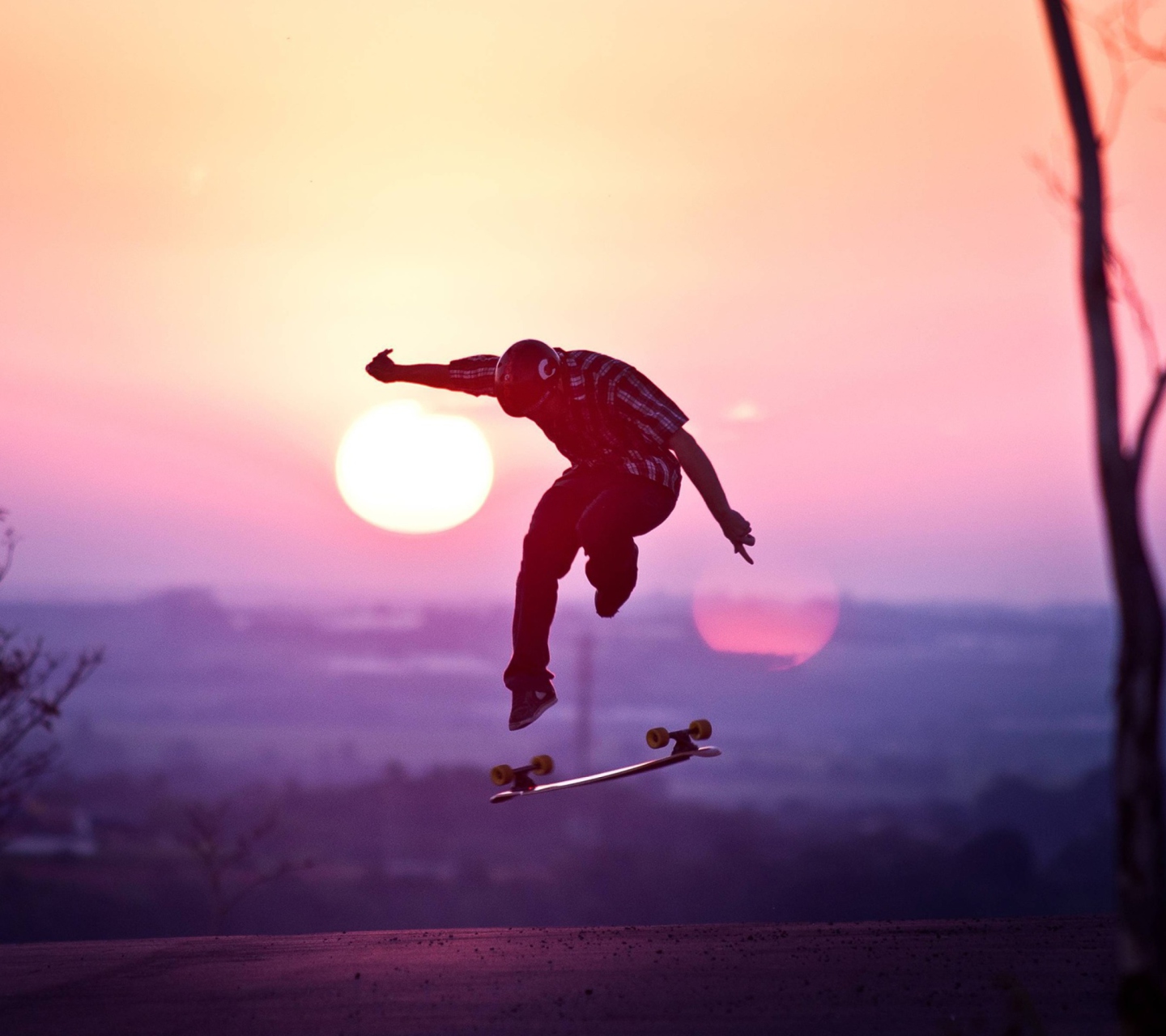 Fondo de pantalla Sunset Skateboard Jump 1440x1280