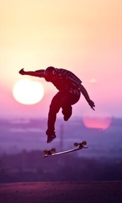 Обои Sunset Skateboard Jump 240x400