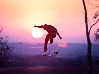 Fondo de pantalla Sunset Skateboard Jump 320x240