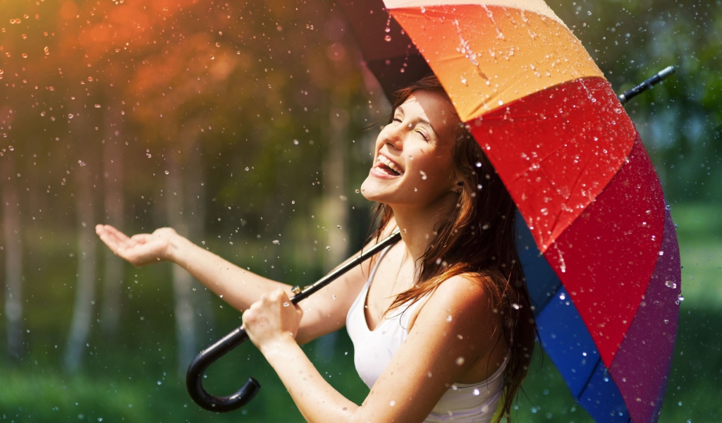 Happy Girl With Rainbow Umbrella Under Summer Rain wallpaper 1024x600