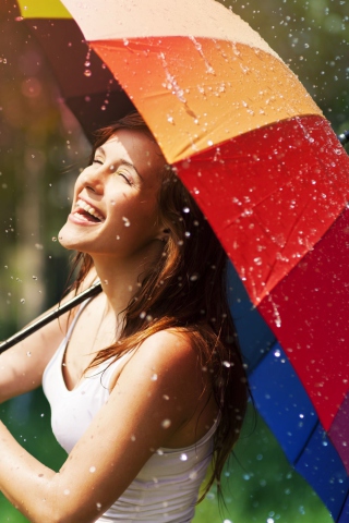 Обои Happy Girl With Rainbow Umbrella Under Summer Rain 320x480