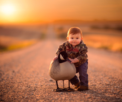 Funny Child With Duck wallpaper 480x400