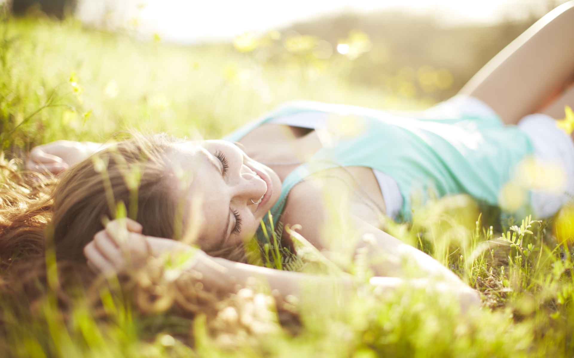 Обои Happy Girl Lying In Grass In Sunlight 1920x1200