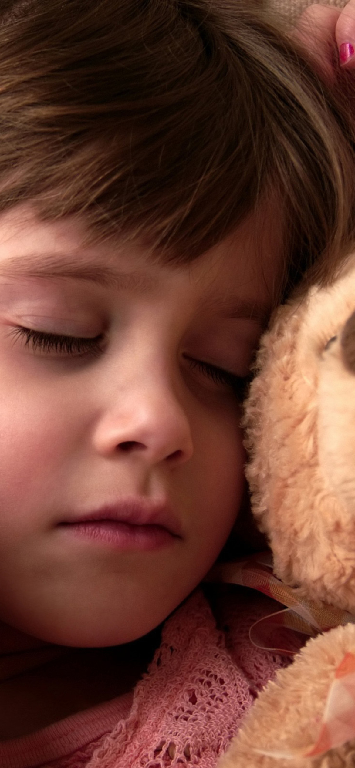 Child Sleeping With Teddy Bear wallpaper 1170x2532