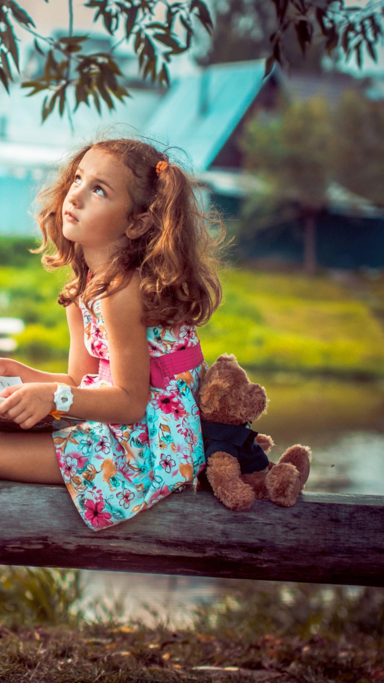 Cute Little Girl With Teddy Bear wallpaper 750x1334