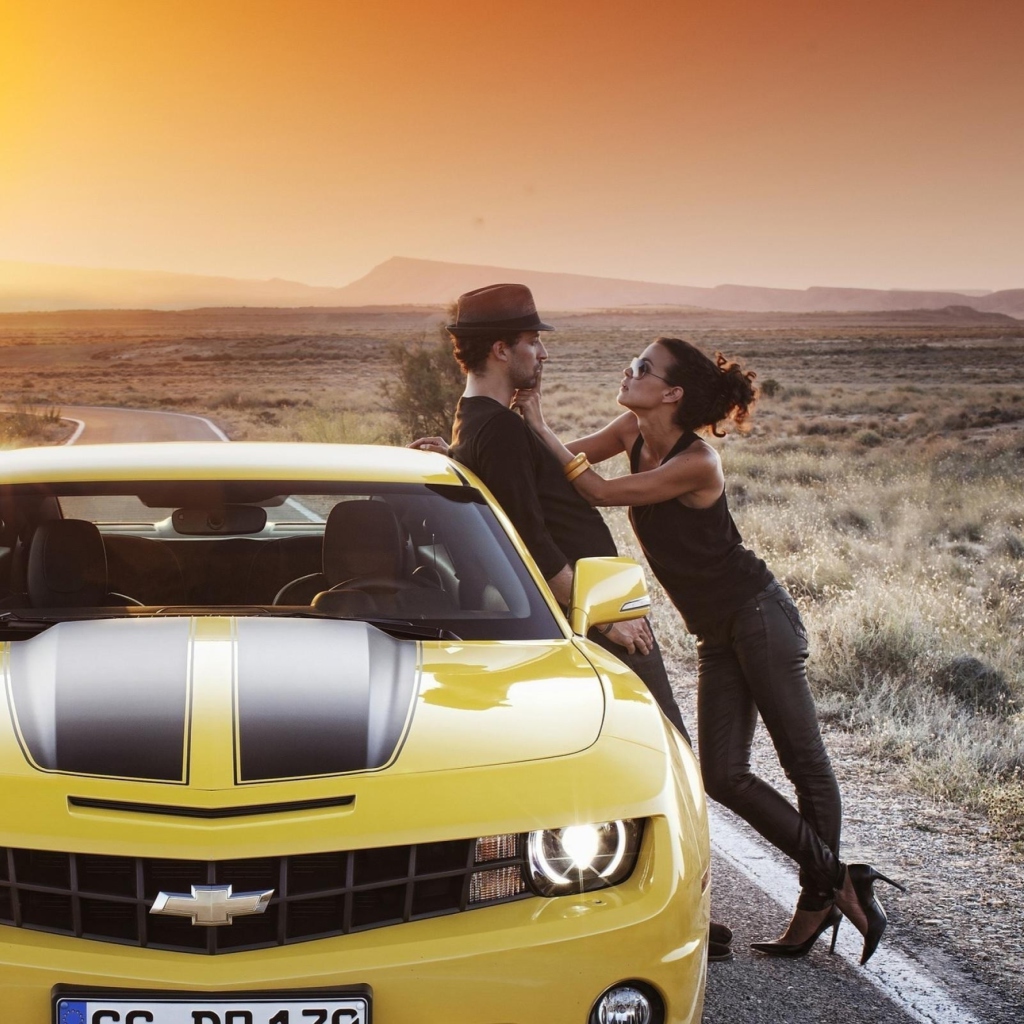Couple And Yellow Chevrolet wallpaper 1024x1024