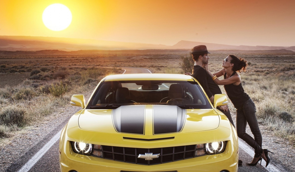 Couple And Yellow Chevrolet wallpaper 1024x600