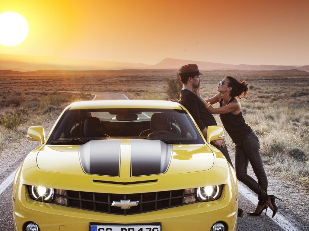 Couple And Yellow Chevrolet wallpaper 1024x768
