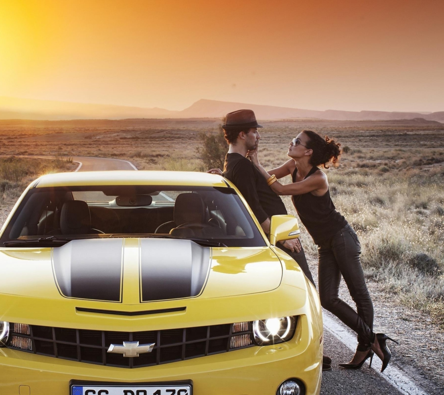 Couple And Yellow Chevrolet wallpaper 1440x1280