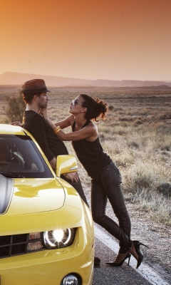 Couple And Yellow Chevrolet wallpaper 240x400