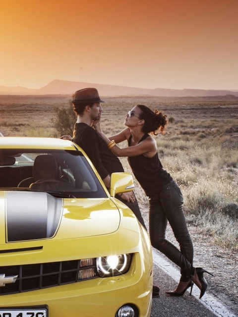 Couple And Yellow Chevrolet wallpaper 480x640