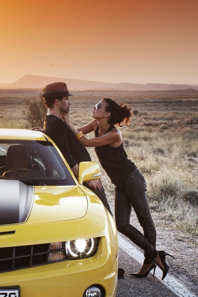 Couple And Yellow Chevrolet wallpaper 640x960