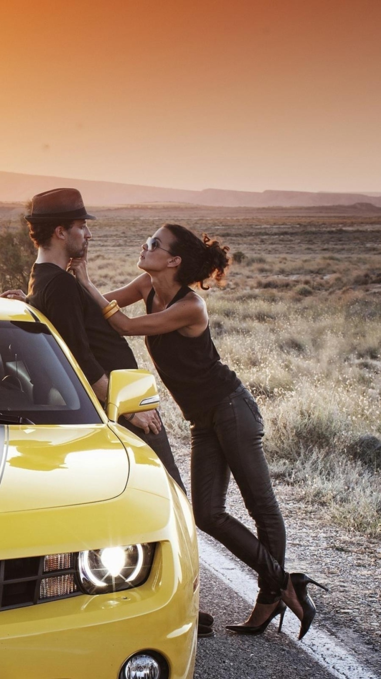 Couple And Yellow Chevrolet wallpaper 750x1334