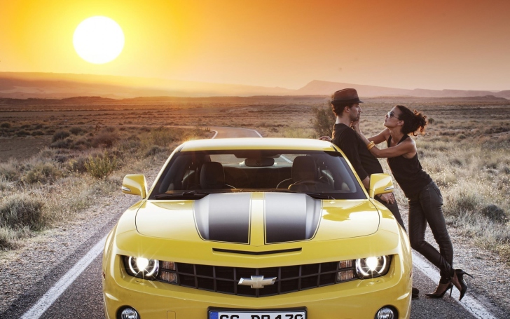 Couple And Yellow Chevrolet wallpaper