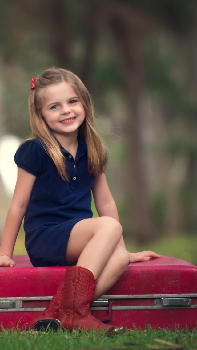 Little Girl Sitting On Red Suitcase wallpaper 640x1136
