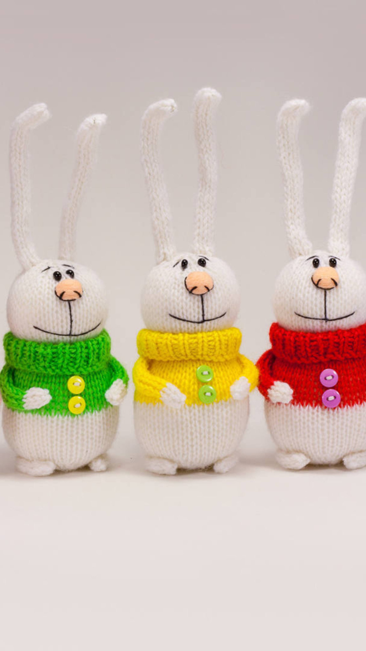 Knitted Bunnies In Colorful Sweaters wallpaper 750x1334
