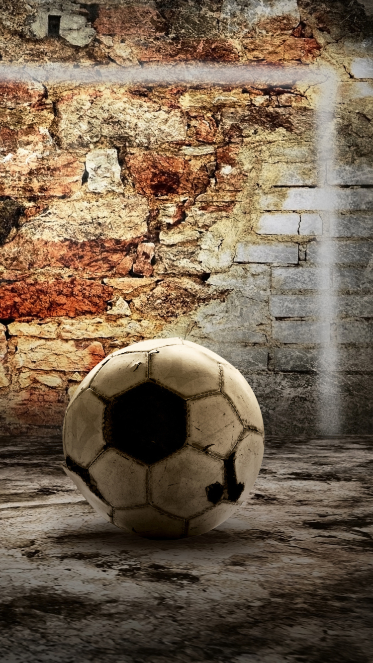 Обои Ball In Front Of Brick Wall 750x1334