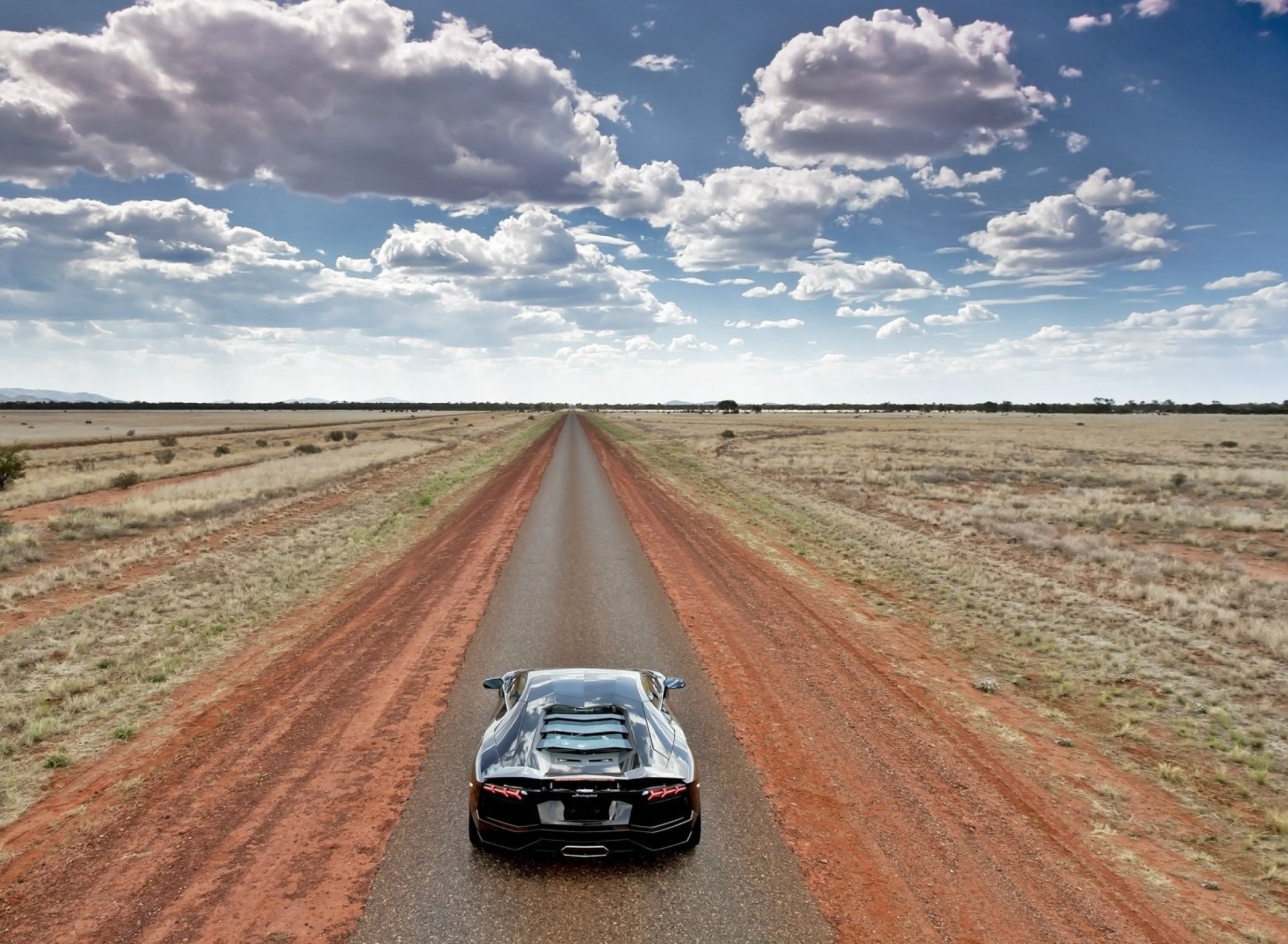 Das Lamborghini Aventador On Empty Country Road Wallpaper 1920x1408