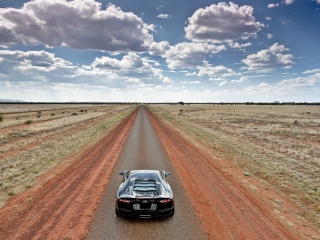 Das Lamborghini Aventador On Empty Country Road Wallpaper 320x240