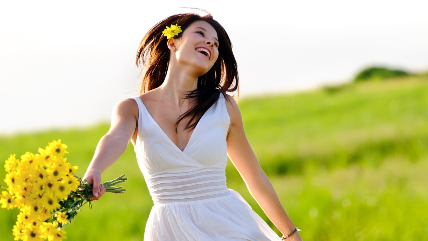 Happy Girl With Yellow Flowers wallpaper 1366x768