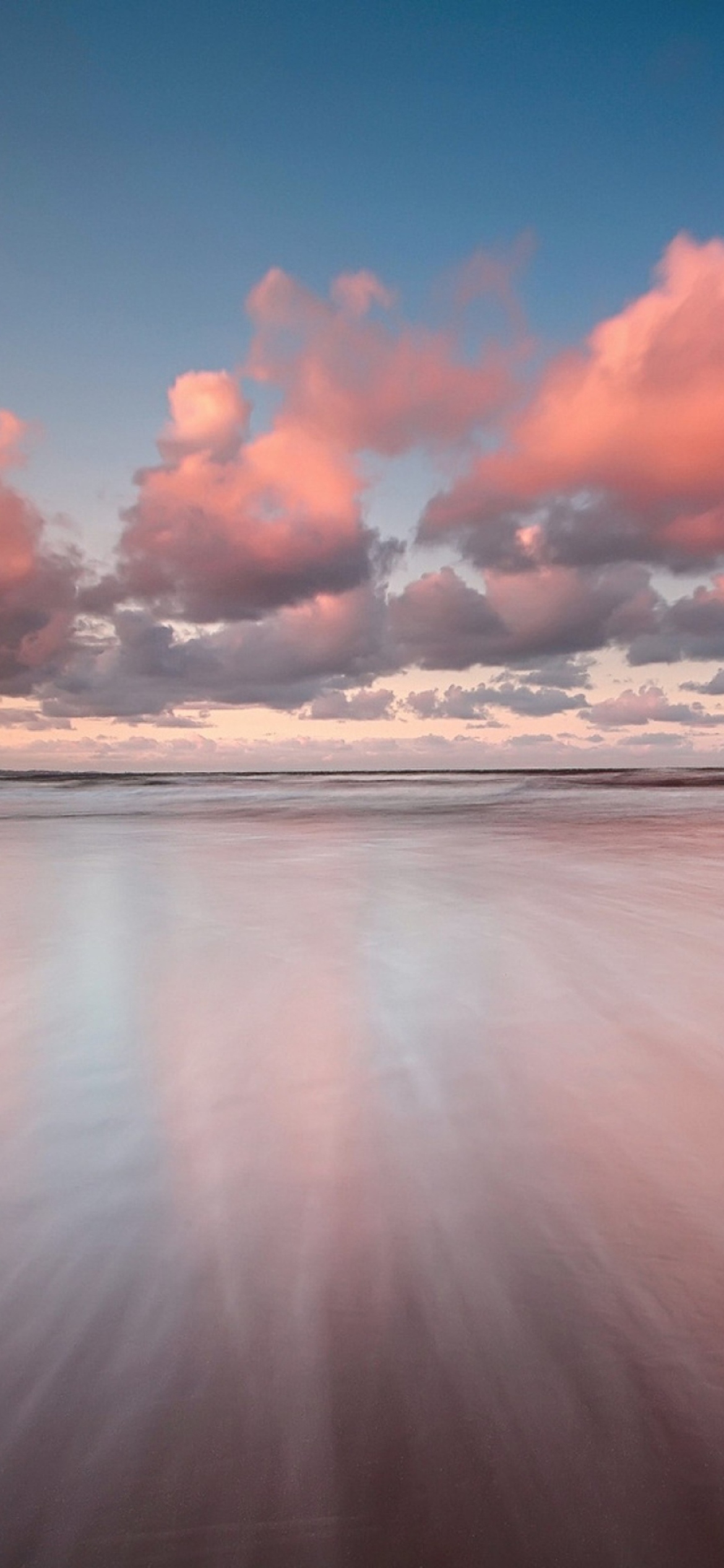 Beautiful Pink Clouds Over Sea wallpaper 1170x2532