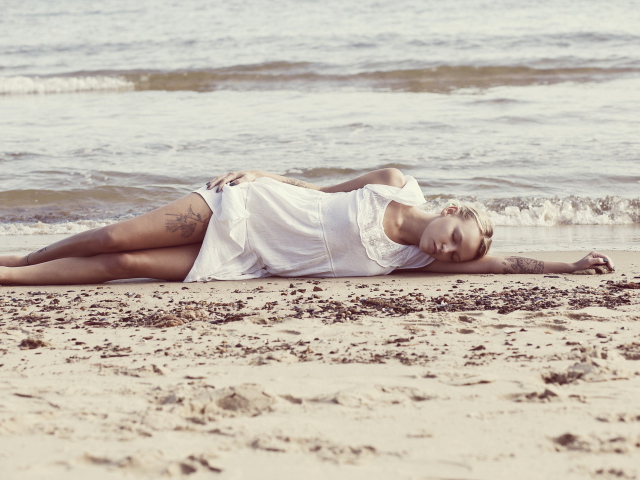 Blonde Girl Lying On Beach wallpaper 640x480