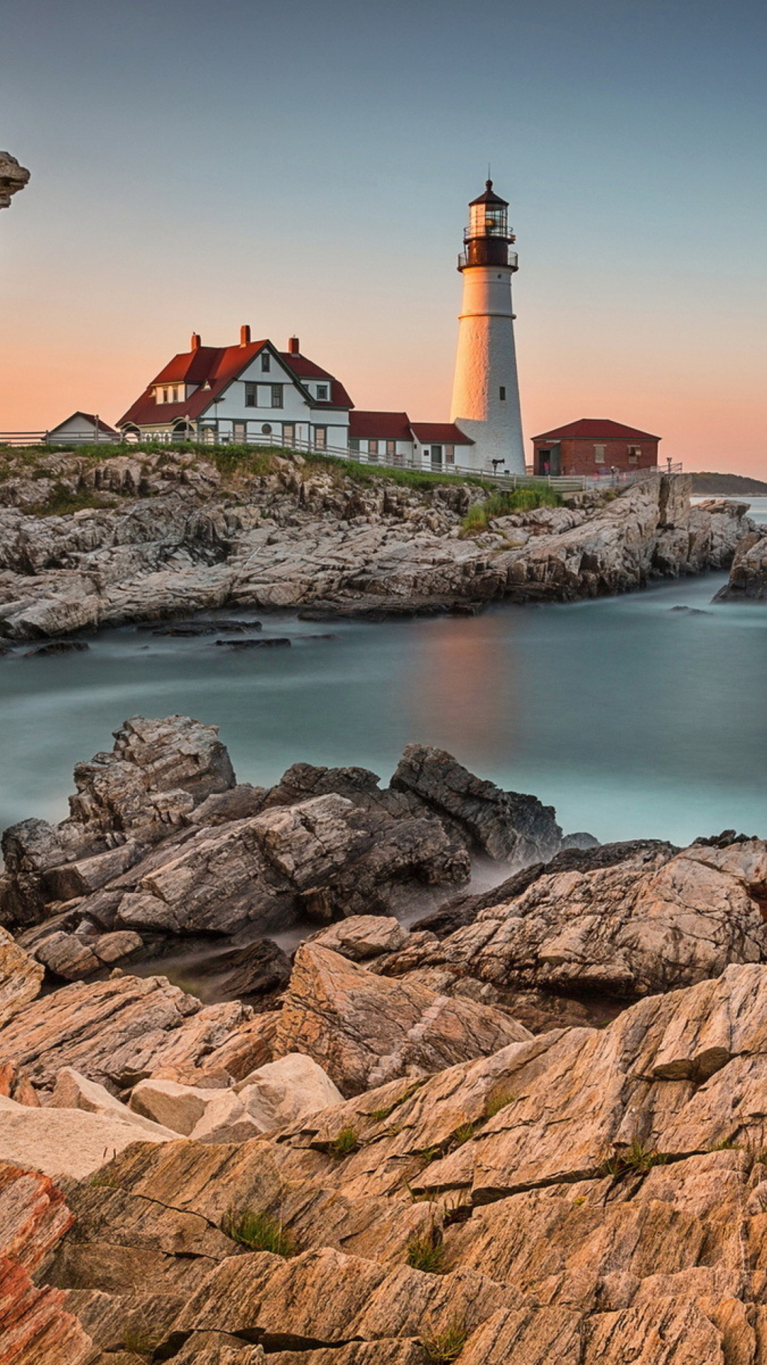 Lighthouse On Rocky Seashore wallpaper 1080x1920