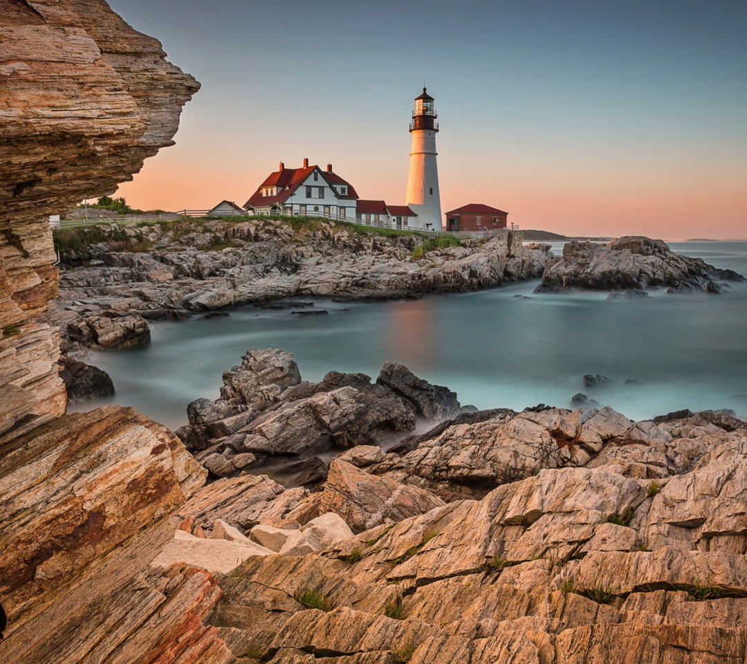 Обои Lighthouse On Rocky Seashore 1080x960