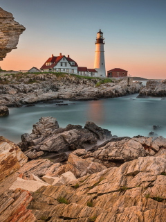 Lighthouse On Rocky Seashore screenshot #1 240x320