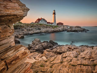 Lighthouse On Rocky Seashore wallpaper 320x240