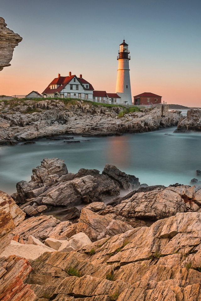 Обои Lighthouse On Rocky Seashore 640x960