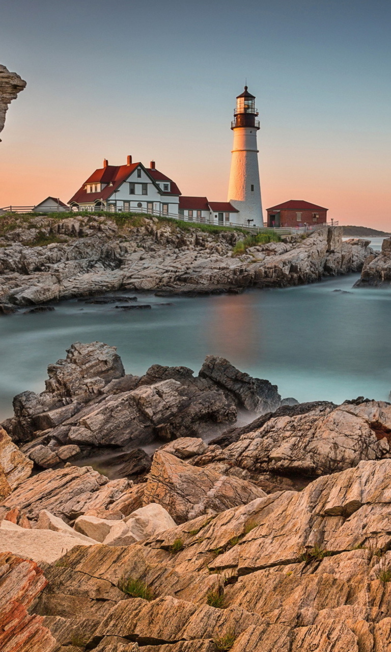 Обои Lighthouse On Rocky Seashore 768x1280